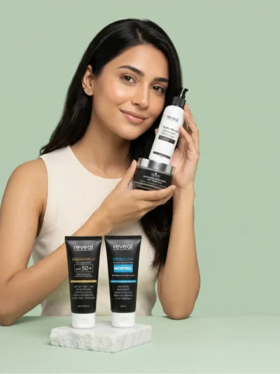 Woman holding Reveal Hydra Barrier moisturizer and brightening cream with AquaShield sunscreen and CoolGlow face wash 4 step skincare routine for oily skin and dark spots Pakistan